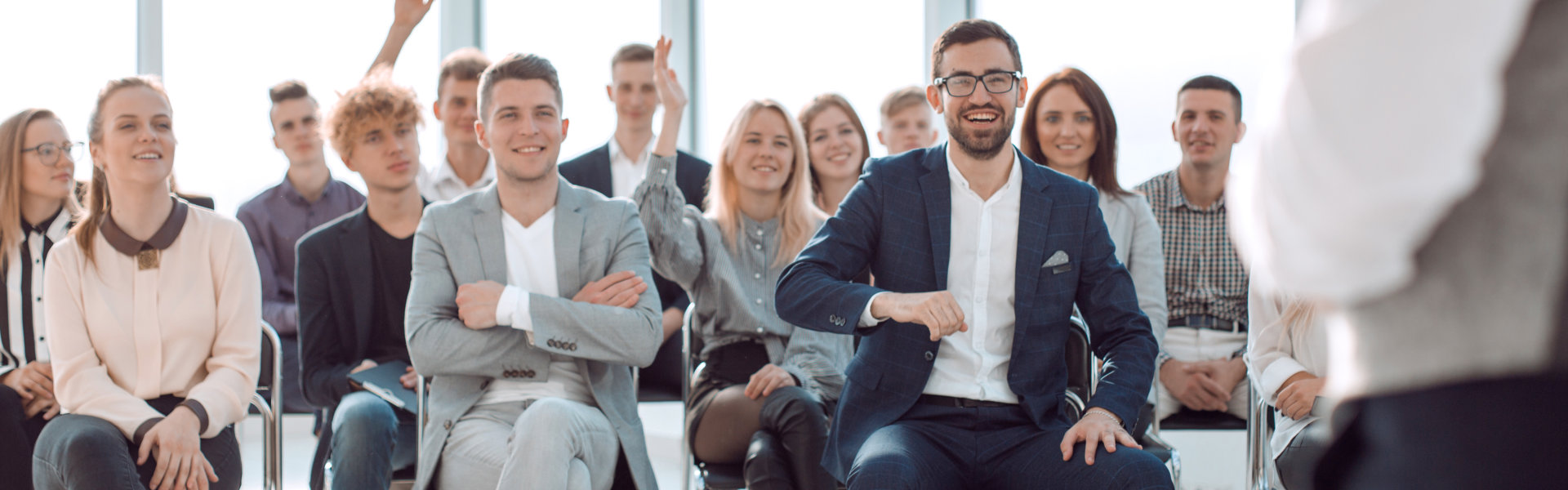 business coach at a meeting with a group of young business people